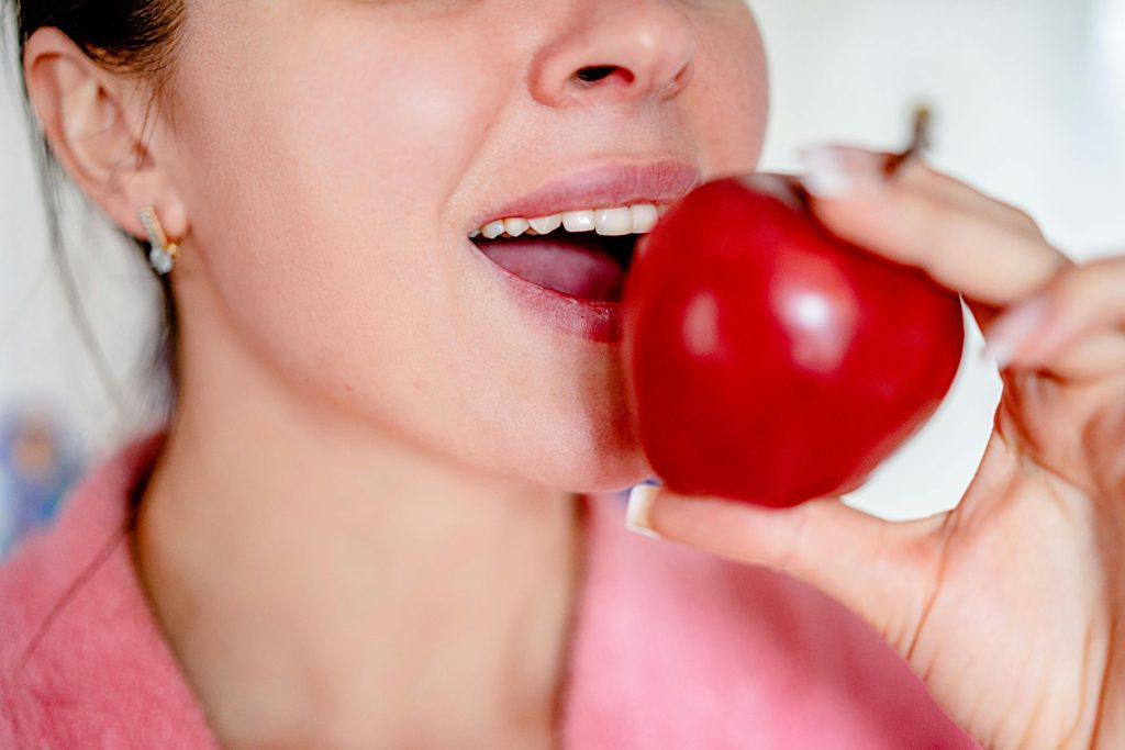 Traveler Enjoying A Healthy Snack Of Apple Slices And Cheese To Maintain Dental Health